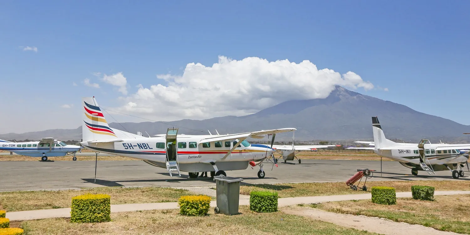 How to book internal flights from Arusha to Serengeti national park - small safari plane landing on a bush runway