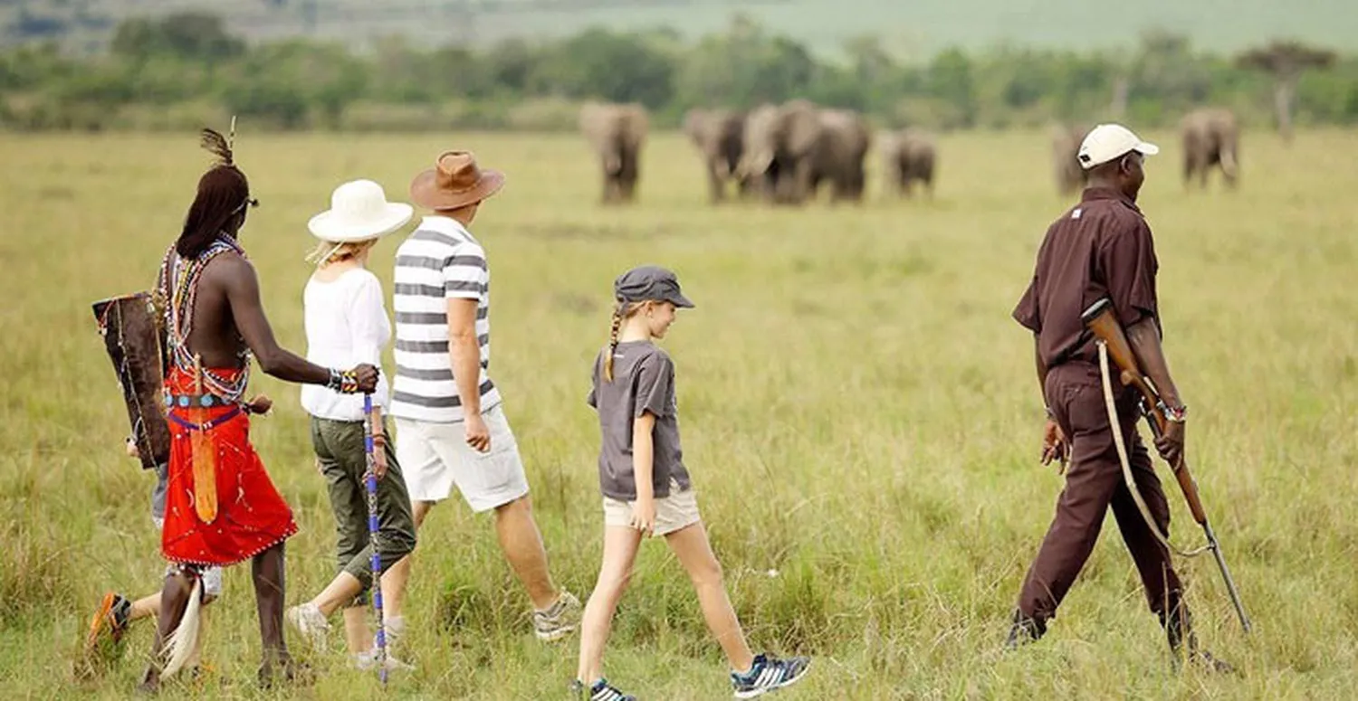 How to book the best Tanzania walking safari packages safely - guided bush walk in the wild