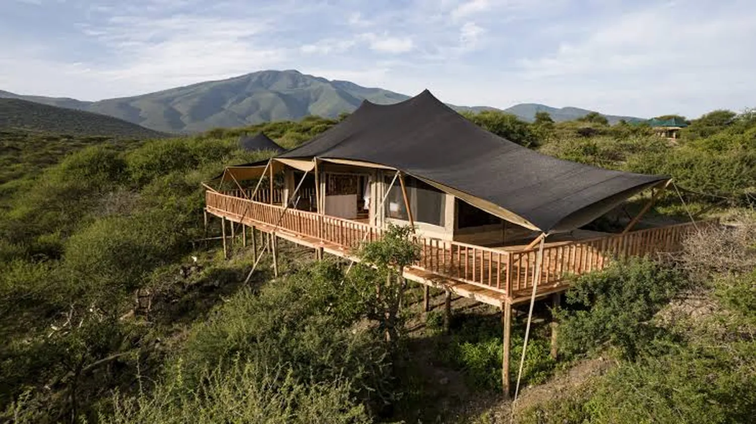 How to experience luxury camping in Ngorongoro permanent tented camps - premium canvas suite on the crater rim edge