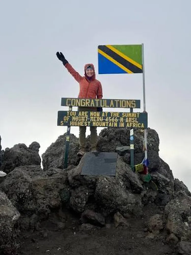 How to select top rated local trekking companies for Mount Meru and Kilimanjaro - Climbers trekking on high-altitude slopes