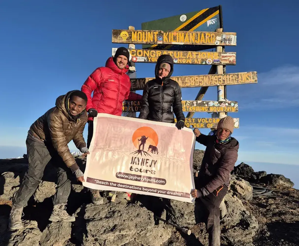 How to spot the best Kilimanjaro trekking companies on a low budget - hikers climbing path safely