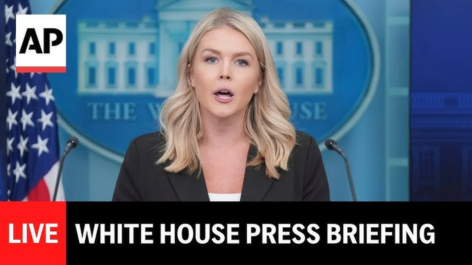 Journalists sitting inside the James S. Brady Press Briefing Room watching a live White House briefing